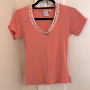 Pink shirt with lace and brooch